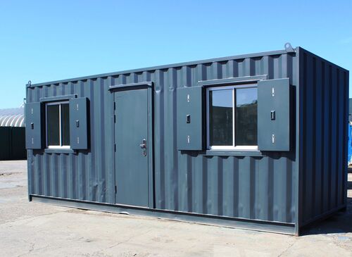 A shipping container converted into a portable office, creating a temporary office space for project management and staff. 