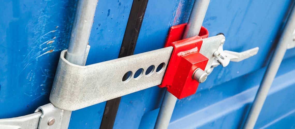 Shipping container secured by a cross bar lock.