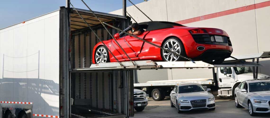 Cars being loaded into a shipping container